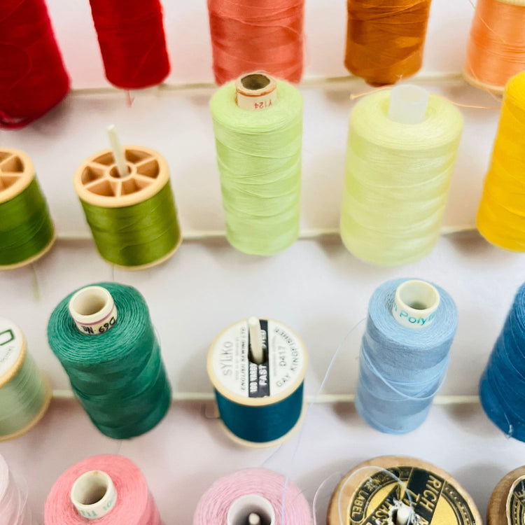 brightly coloured cotton reels abstract close up